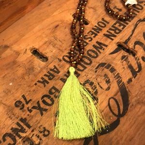 Long wood beads with lime green tassel